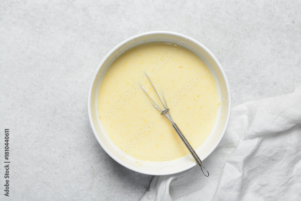 Naklejka premium Overhead view of custard for making bread pudding, process of making bread pudding