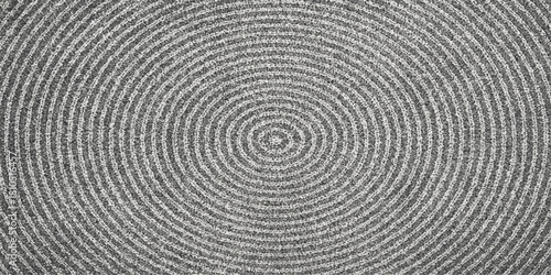 Black and white macro photo of a textured wooden spiral pattern background