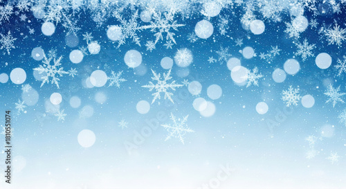Stunning professional stock image featuring a frosty blue winter background adorned with sparkling snowflakes and glowing bokeh.