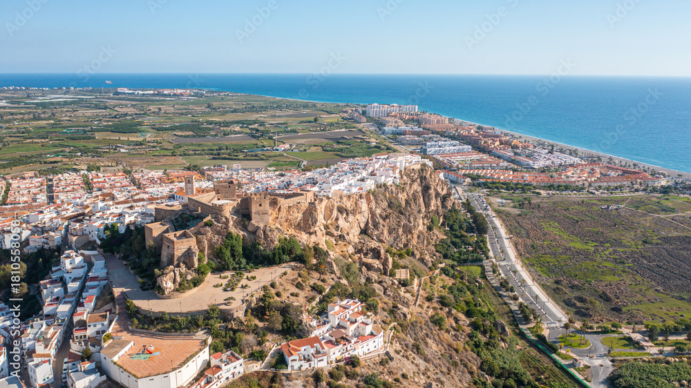 Obraz premium Aerial photo from drone to Salobreña Castle and the city of Salobrena, mountains and sea in the background. Spain Andalusia