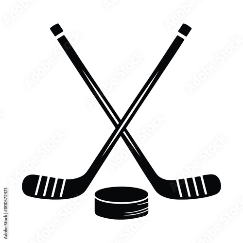 Crossed hockey sticks and a puck silhouette sport of ice hockey on a white background