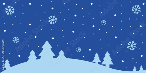 A winter scene with snowflakes falling over trees on a snowy hill against a blue background sky night