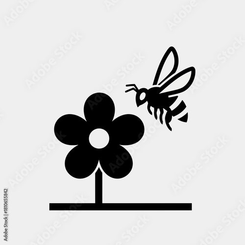 Illustration of a bee approaching a flower, depicted in a simple black and white design, isolated on, conveying natures beauty