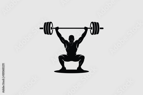 Muscular athlete lifting heavy barbell in squat position weightlifting