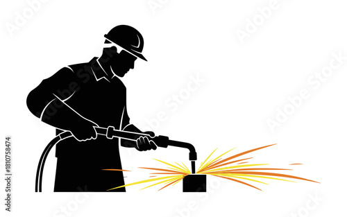 Silhouette of a welder working with a torch, creating sparks.
