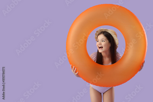 Cute girl with orange swim ...
