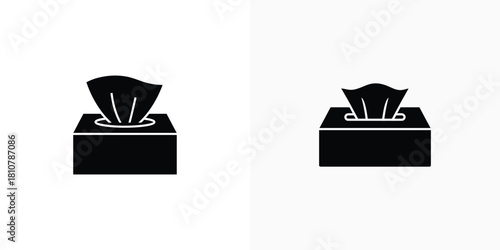 A pair of black silhouette icons depict different styles of rectangular tissue boxes with tissues