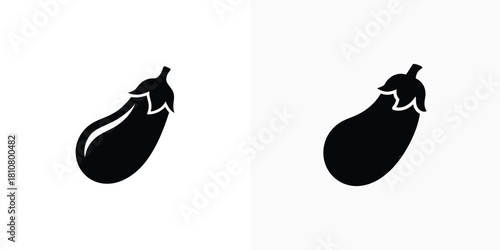 Two sleek black eggplant silhouettes displayed side by side against a clean white background