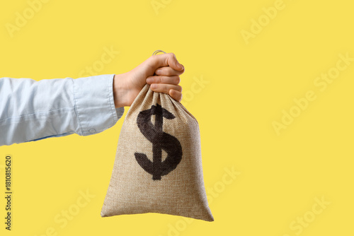 Female hand with burlap mon...