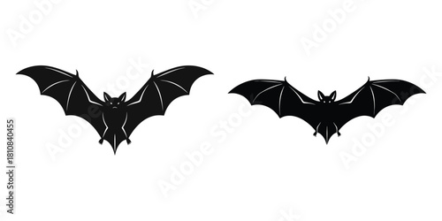 Two bat silhouettes are displayed against a white background creating a spooky Halloween vibe
