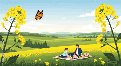 Family having a picnic in a field of yellow flowers with a butterfly flying overhead.