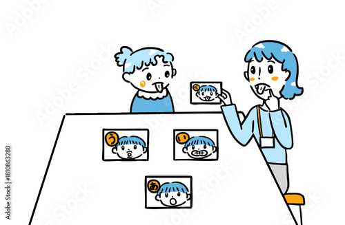 言葉カードで発音を学ぶ子ども