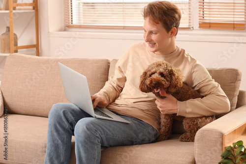 Young man using modern lapt...
