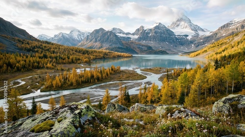 Stunning Turquoise Mountain Lake with Snow Peaks and Golden Autumn Forest