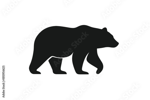 Simple black silhouette of a large bear walking across a white background