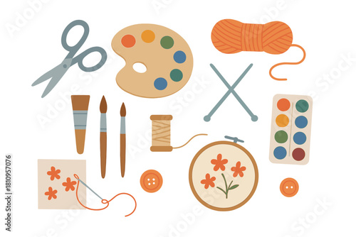 Collection of creative hobby tools and art supplies including scissors, paint, brushes, yarn, and embroidery materials
