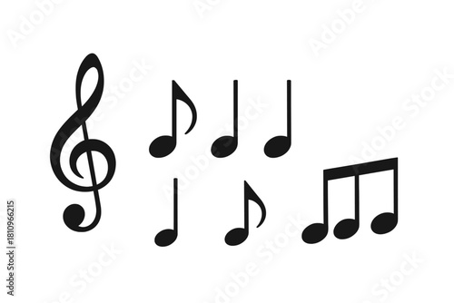 Collection of black musical symbols including treble clef and various notes