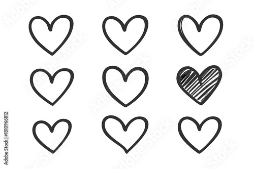 Set of nine hand drawn doodle hearts in black outline and one filled style