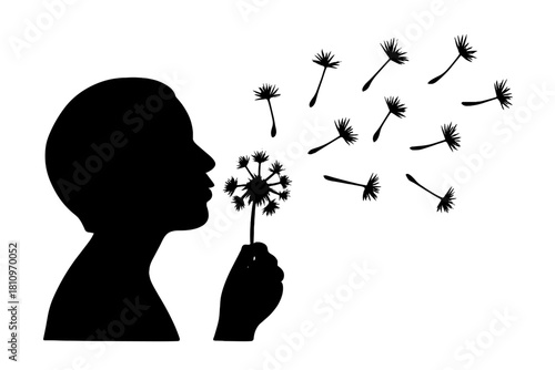 Black silhouette of a person blowing dandelion seeds into the air on a clean white background