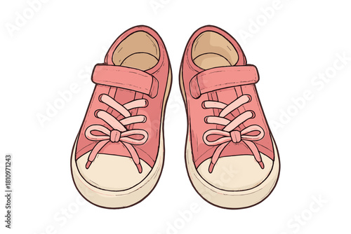 Cute pink canvas sneakers for children with laces and velcro straps isolated on white