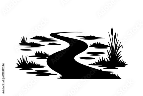 Winding path through a swampy marshland with reeds and cattails silhouette