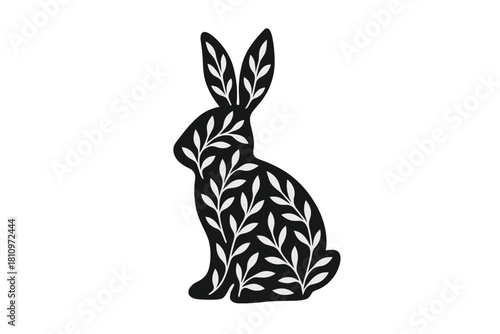 Black rabbit silhouette filled with white botanical leaf pattern on a white background