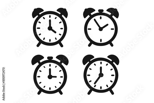 Four black alarm clock icons displaying different times for scheduling and waking up