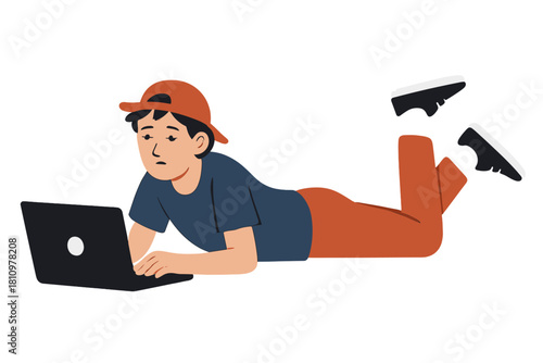 Worried young person lying on stomach focused on laptop screen
