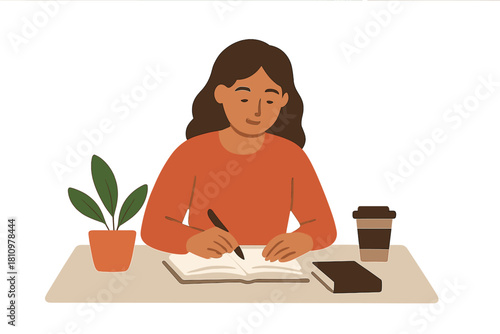 Focused woman writing in notebook at home desk with coffee