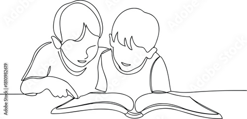 Two children reading a book together one pointing learning
