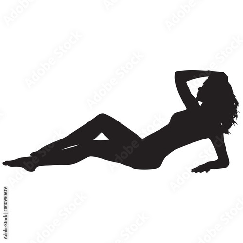 Silhouette of a seductive woman posing provocatively while reclining on her side