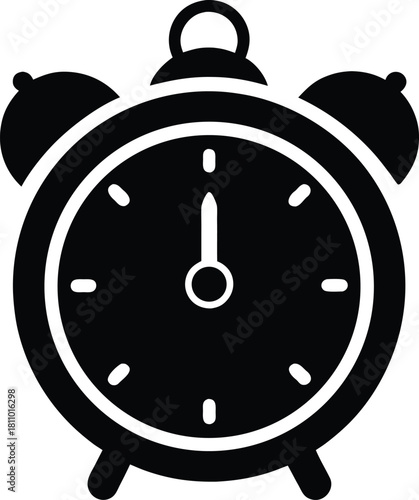 Classic alarm clock with minute hand pointing to twelve and hour hand hidden
