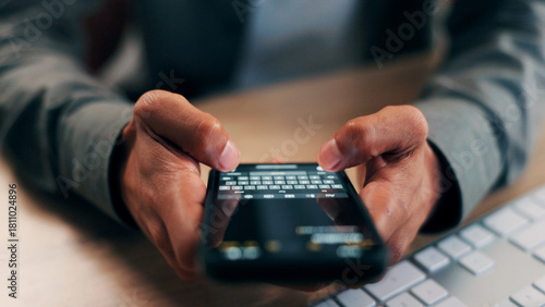 Hands, phone screen and text message with business person at desk in office for communication. App, fingers and typing with employee in workplace for mobile chatting, post update or reply closeup