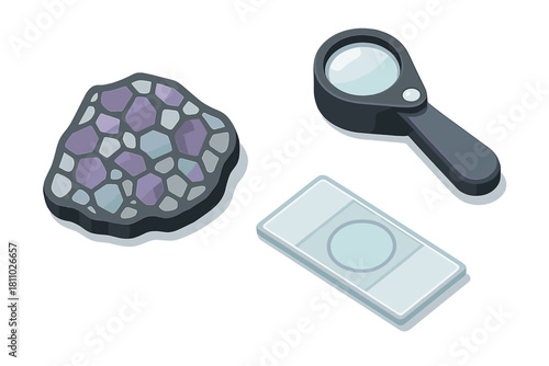 Geological research tools set with magnifying glass, mineral sample, and microscope slide for scientific analysis