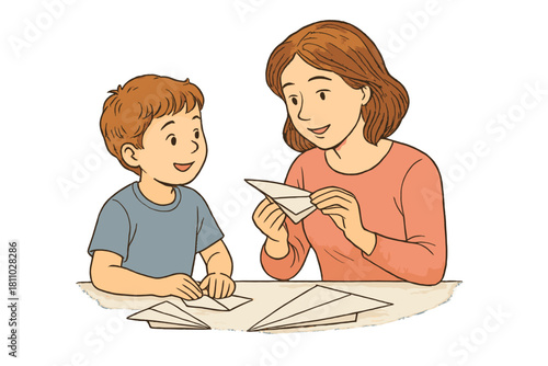 Happy woman teaching young boy how to fold paper airplanes for creative family fun