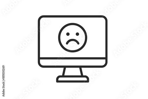 Desktop computer screen displaying a sad face icon symbolizing system error or failure