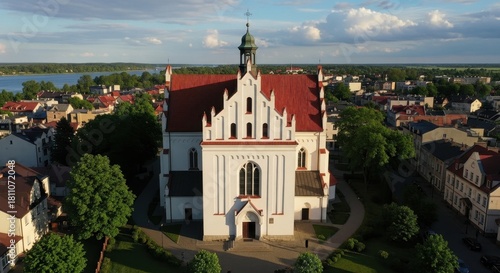 Serene aerial view showcases a majestic church amidst an urban landscape scenery