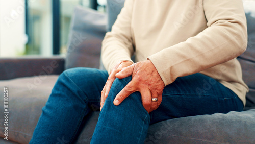 Bild auf Leinwand Knee pain, home and senior man on sofa with injury for arthritis, osteoporosis and fibromyalgia
