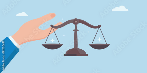 Hand holding scales of justice representing fairness and legal balance