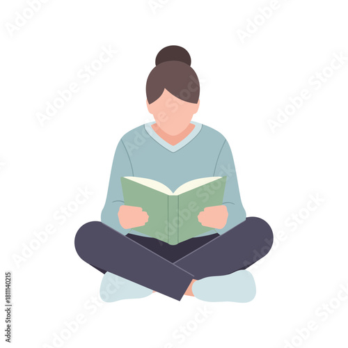 A woman is sitting cross-legged reading a book.