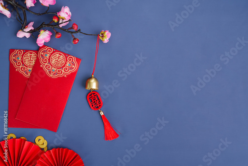 Chinese New Year red envelopes and decorations with cherry blossoms