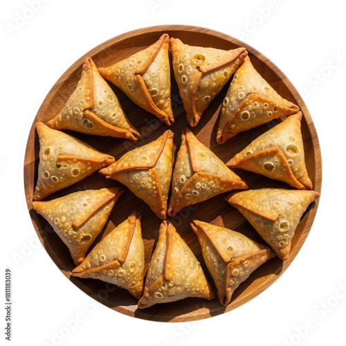 Fried samosas on a wooden plate, top view isolated on transparent background