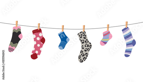 Wool and cotton socks hanging on a rope with clothespins, decorated with playful textures and patterns, perfect for laundry, kids clothing and cozy home decor projects.