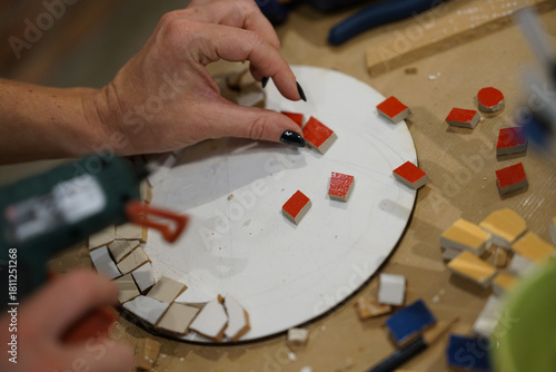 Making mosaic during artistic workshop. 