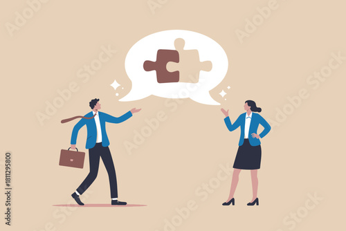 Business collaboration concept with two colleagues solving a puzzle.