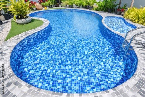 blue mosaic tiles in swimming pool with white stone floor and green plants