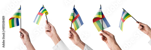 The Central African Republic flag in hand in different angles on a white background
