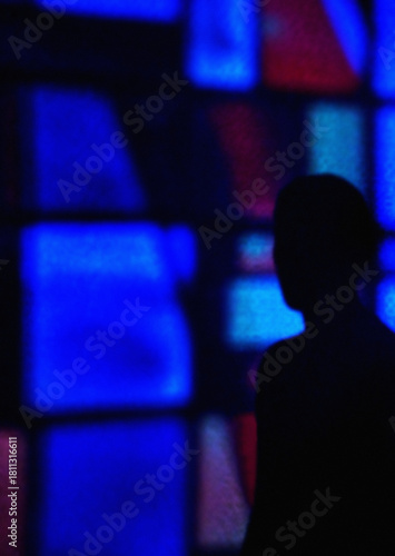 Silhouette in neon night light expressing mystery and mental health themes