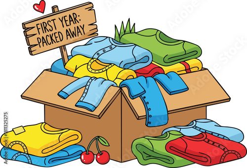 Cardboard box filled with colorful folded clothes and a sign reading First Year Packed Away plus cherries and hearts