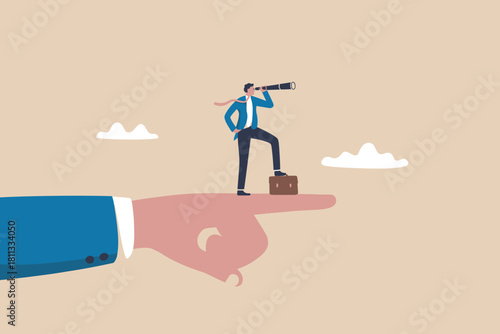 Businessman looks to the future supported by a guiding hand